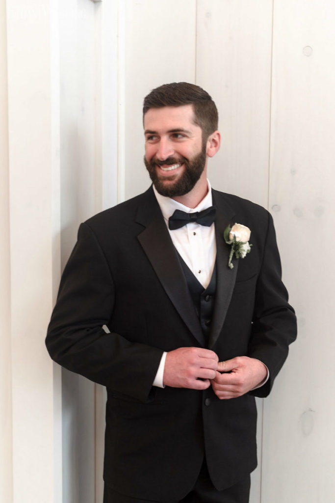 groom in a black tuxedo