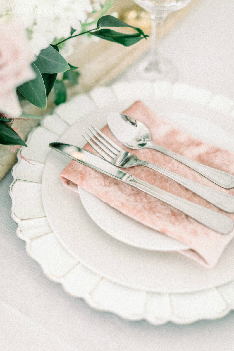 peach and white table setting for a wedding