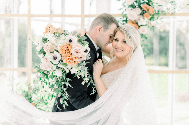 bride and groom with gorgeous bridal bouquet