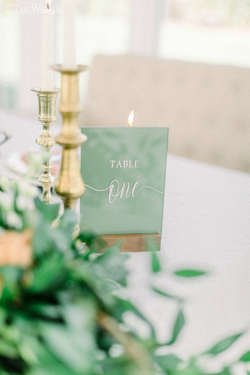green and white table number sign